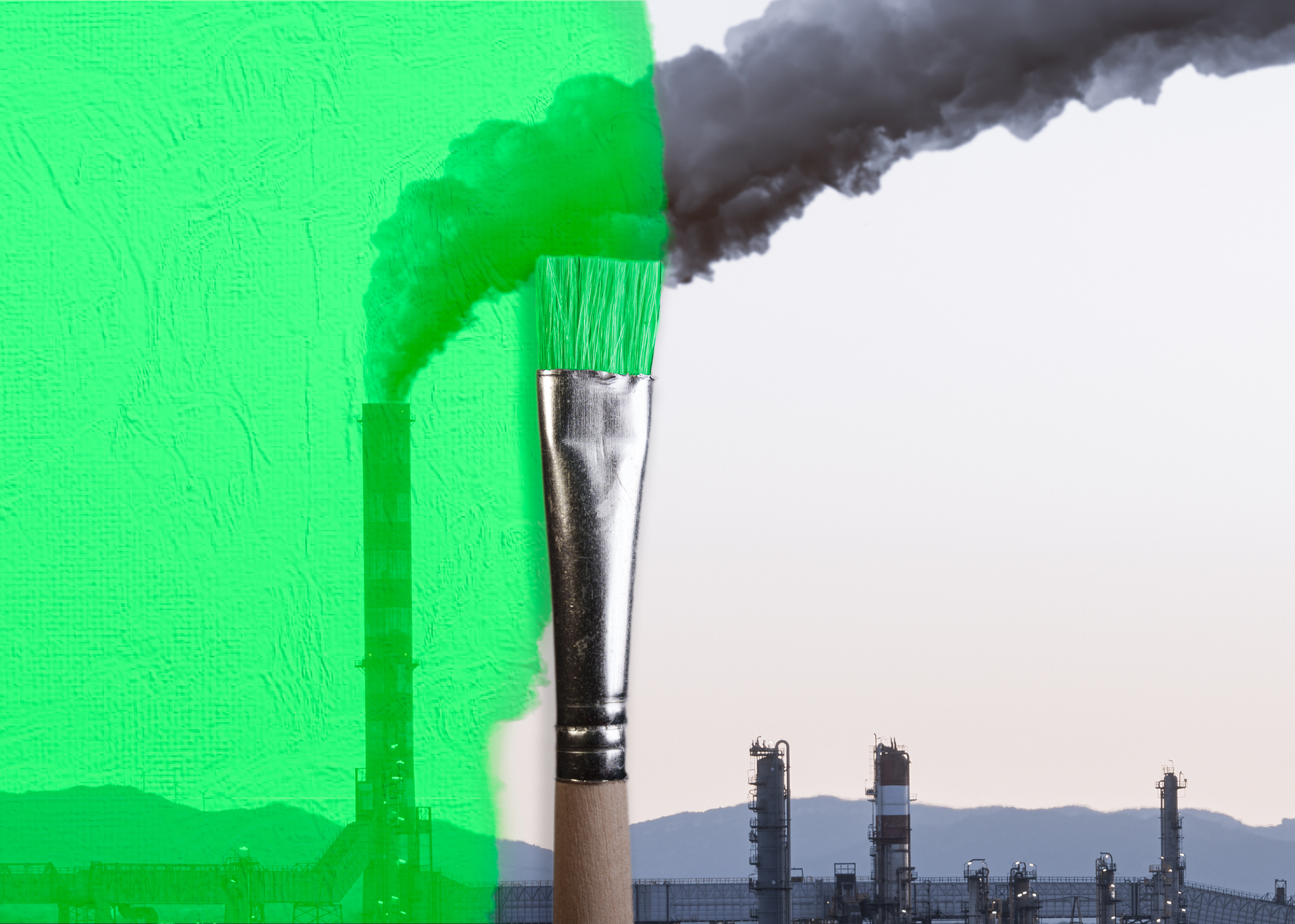 Pincel pintando de verde una chimenea industrial. Concepto de negligencia de lavado verde
